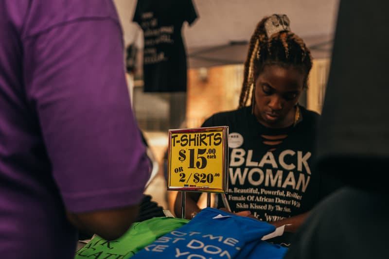T-shirt vendor showcasing empowering apparel at the festival